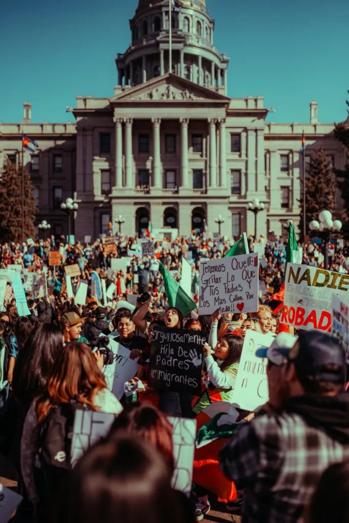 Demonstrators with signs in front of a government building