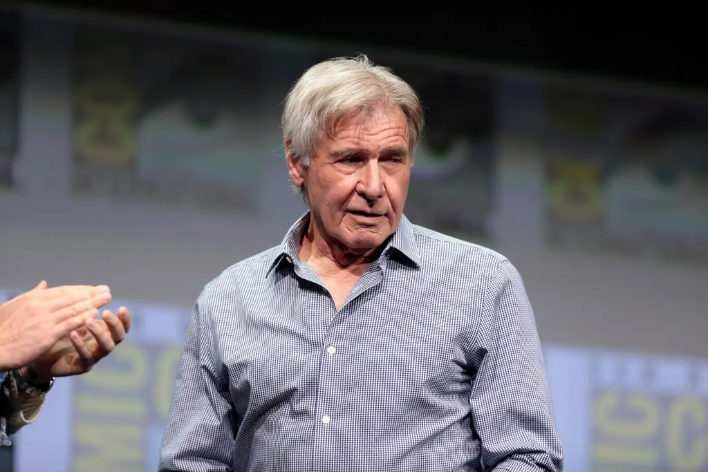 Harrison Ford speaking into a microphone at San Diego Comic-Con 2017