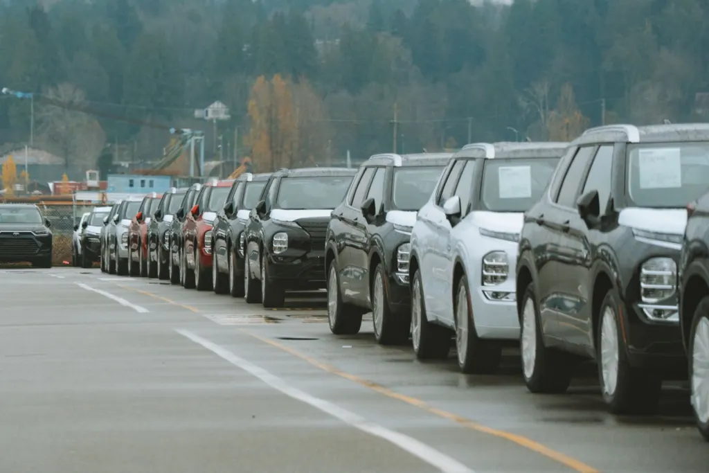 Hours of work: Rows of new SUVs parked in an outdoor dealership lot