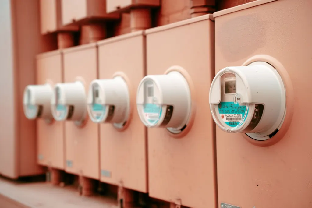Row of industrial electricity meters mounted on a wall