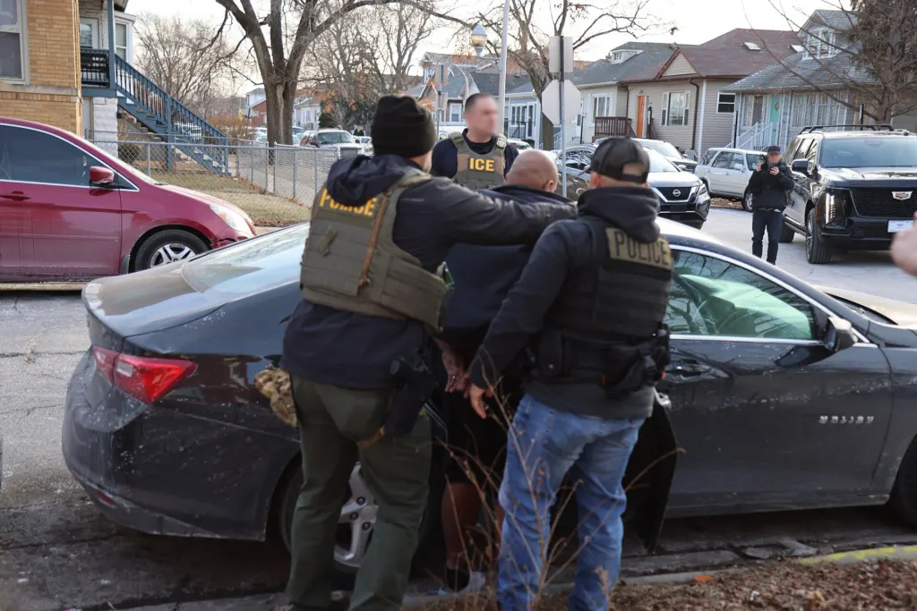 ICE wrongful detention bill: Immigration and Customs Enforcement officers in vests during an operation in Chicago