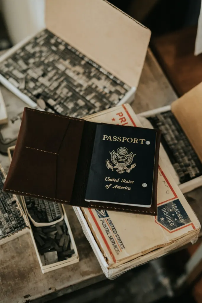 ICE wrongful detention bill: Dark blue United States passport resting on a white box