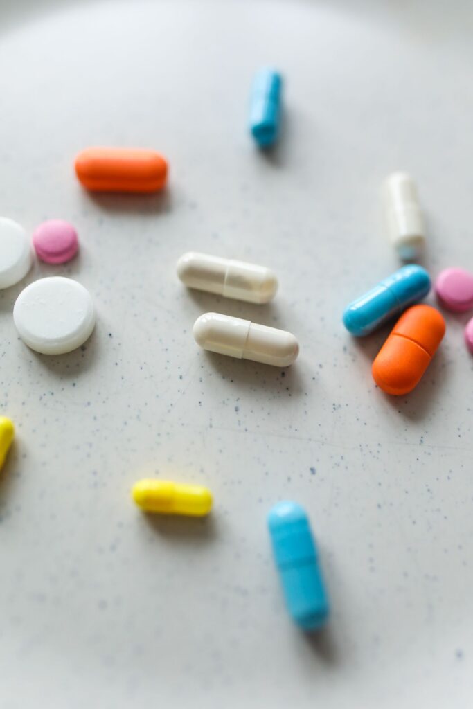 Assorted pills and capsules on a surface